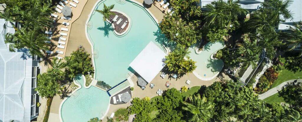 oaks port douglas resort pool view aerial lap pool treest 1312x533